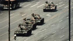 A Beijing demonstrator blocks the path of a tank convoy along the Avenue of Eternal Peace near Tiananmen Square during protests for freedom of speech and of press from the Chinese government. (Credit: Bettmann Archive/Getty Images)